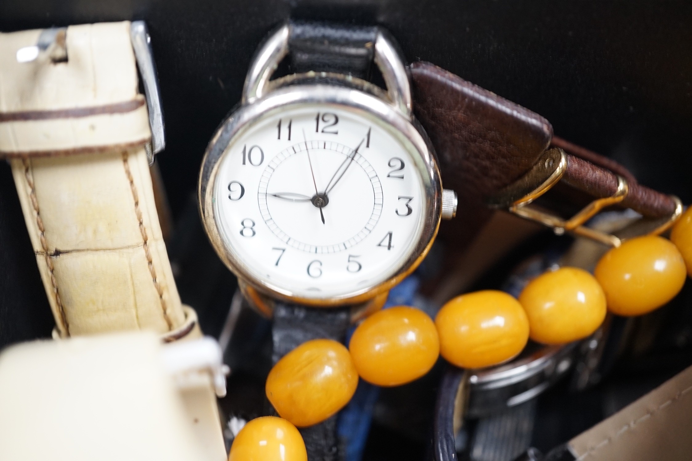 A quantity of assorted gentleman's modern wrist watches and two necklaces including amber style.